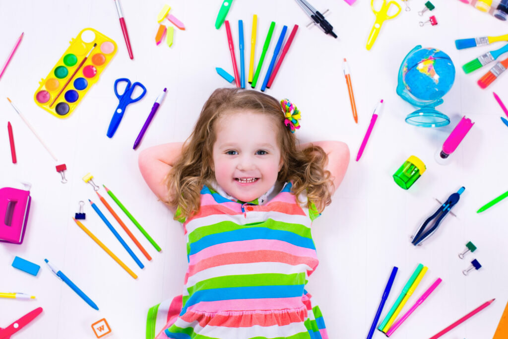 Littel girl with school supplies Littel girl with school supplies