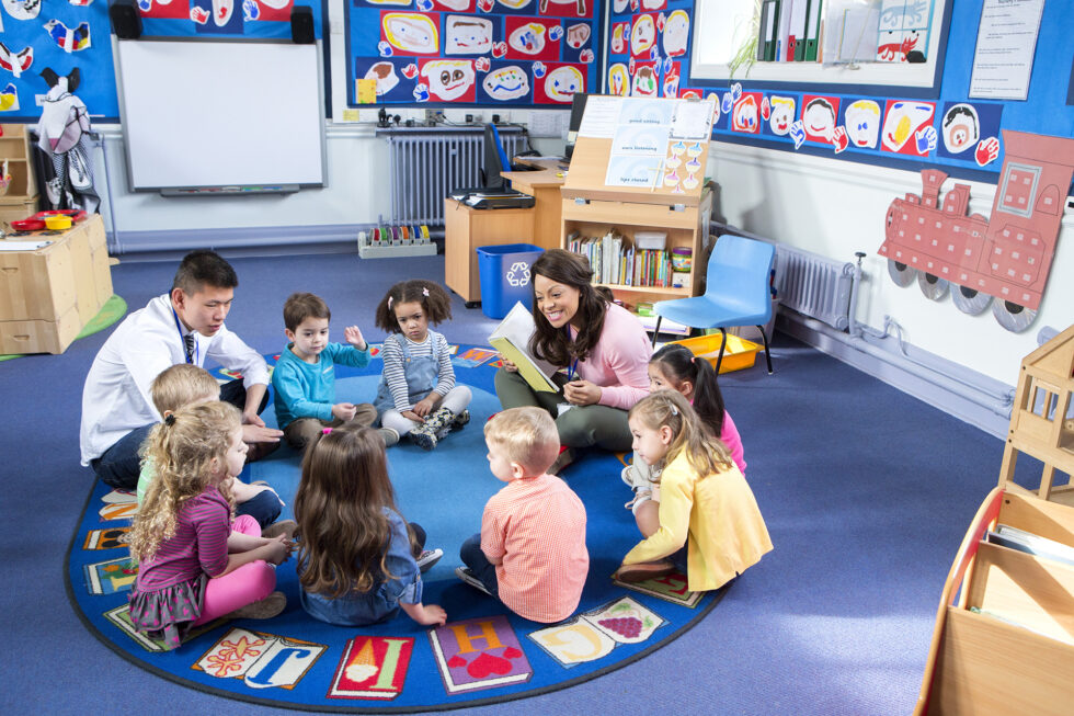 kids sitting around a circle reading