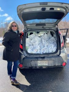 Susan distributes pantry bags to Head Start families.
